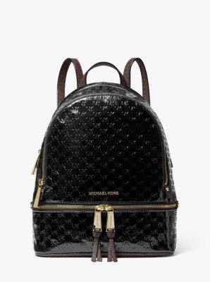 Rhea Medium Logo Embossed Patent Leather Backpack in BLACK | Michael Kors
