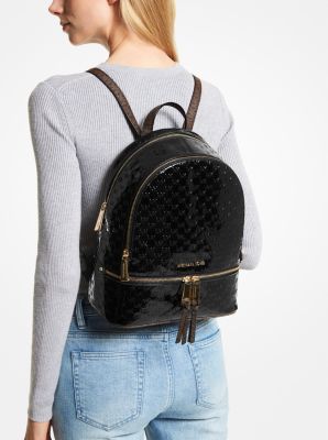 Rhea Medium Logo Embossed Patent Leather Backpack in BLACK | Michael Kors