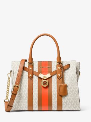 white and brown michael kors purse