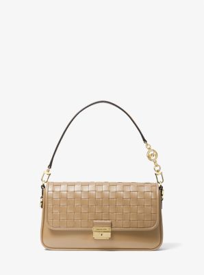 Shop MICHAEL Michael Kors Small Bradshaw Woven Leather Shoulder