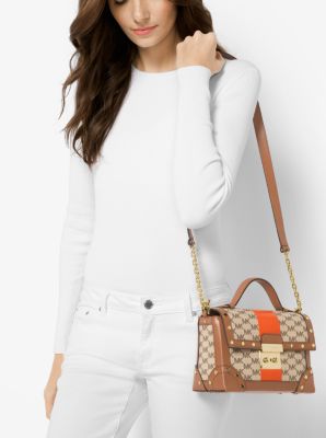 Michael kors cori trunk bag best sale