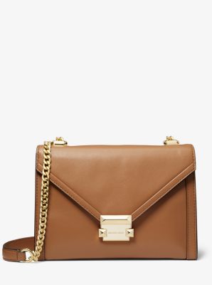 whitney logo pebble leather shoulder bag