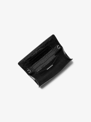 Cate Crocodile Embossed Patent Leather Clutch in BLACK | Michael Kors