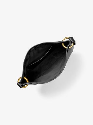 Bandolera mediana Tate de piel con borlas