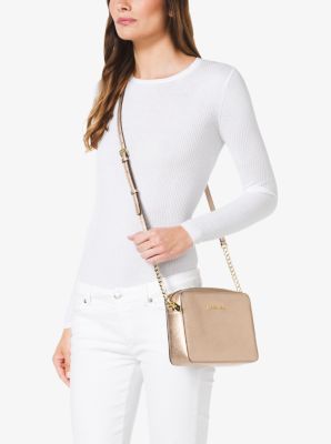 You should definitely buy this metallic Michael Kors crossbody bag