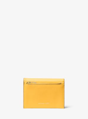 You should definitely buy this sleek Michael Kors wallet while