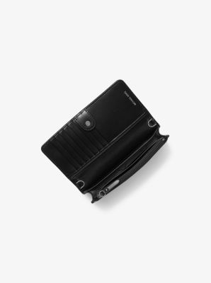 Sac &agrave; bandouli&egrave;re convertible en poils de veau &agrave; imprim&eacute; l&eacute;opard et en cuir