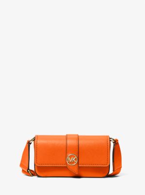 Bandolera riñonera Greenwich extrapequeña de piel safiano in NARANJA INTENSO | Michael Kors