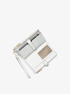 Portefeuille Adele en cuir tress&eacute; pour t&eacute;l&eacute;phone intelligent in BLANC OPTIQUE | Michael Kors