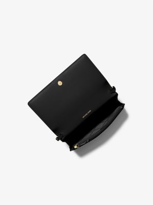 Sac &agrave; bandouli&egrave;re Jet&nbsp;Set de taille moyenne en cuir grain&eacute; avec rabat sur le devant in NOIR | Michael Kors