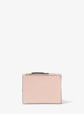 You should definitely buy this sleek Michael Kors wallet while