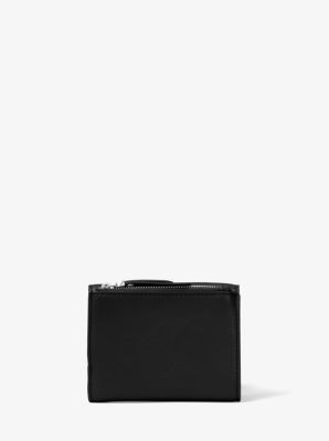 You should definitely buy this sleek Michael Kors wallet while