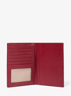 Jet Set Medium Metallic Logo Debossed Passport Wallet in CHERRY | Michael Kors