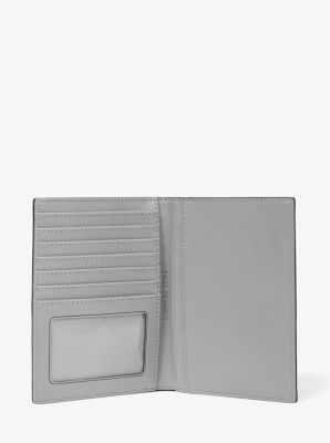 Jet Set Medium Patent Logo Debossed Passport Wallet in SILVER | Michael Kors