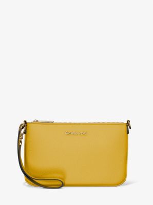Petite pochette-bracelet Jet Set convertible en cuir grainé