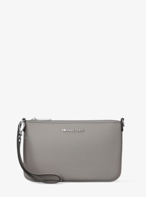 Petite pochette-bracelet Jet Set convertible en cuir grainé