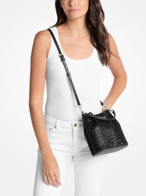 Carson Small Floral Laser Cut Bucket Crossbody Bag in BLACK | Michael Kors