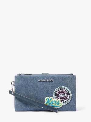 Pochette-bracelet Jet Set Travel en denim &agrave; ornements