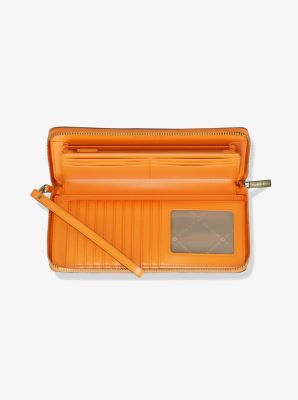 Grande pochette-bracelet Jet Set Travel en cuir grainé