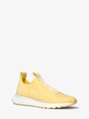 Michael Kors Bodie Logo Embossed Stretch Knit Slip-on Trainer In Yellow