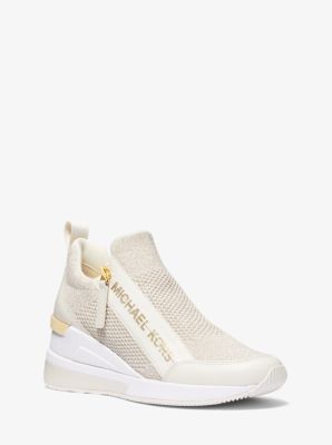 Shop Michael Kors Willis Metallic Stretch Knit Trainer In Gold