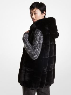 Black vest shop with fur hood