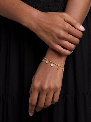 Bracelet &agrave; pav&eacute; avec breloques en forme de disque