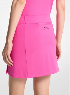 Mini jupe-short de golf en tricot extensible in CERISE | Michael Kors