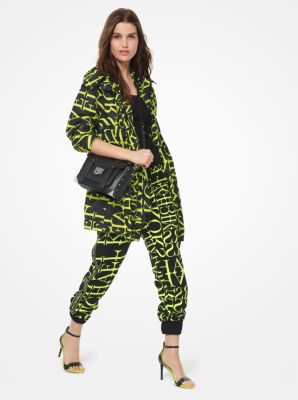 Pantalon de jogging en cady &agrave; imprim&eacute; de papier journal &agrave; logo