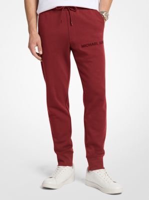 Joggers en mezcla de algodón con logotipo en relieve